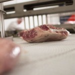 Flavorseal product packaging on slaughter facility line